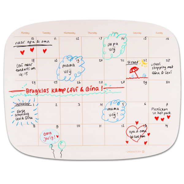 Sticky whiteboard monthly planner organic with sticky tabs, written with whiteboard pen.